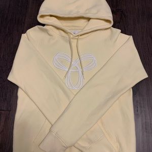 Women’s yellow TNA hoodie size medium